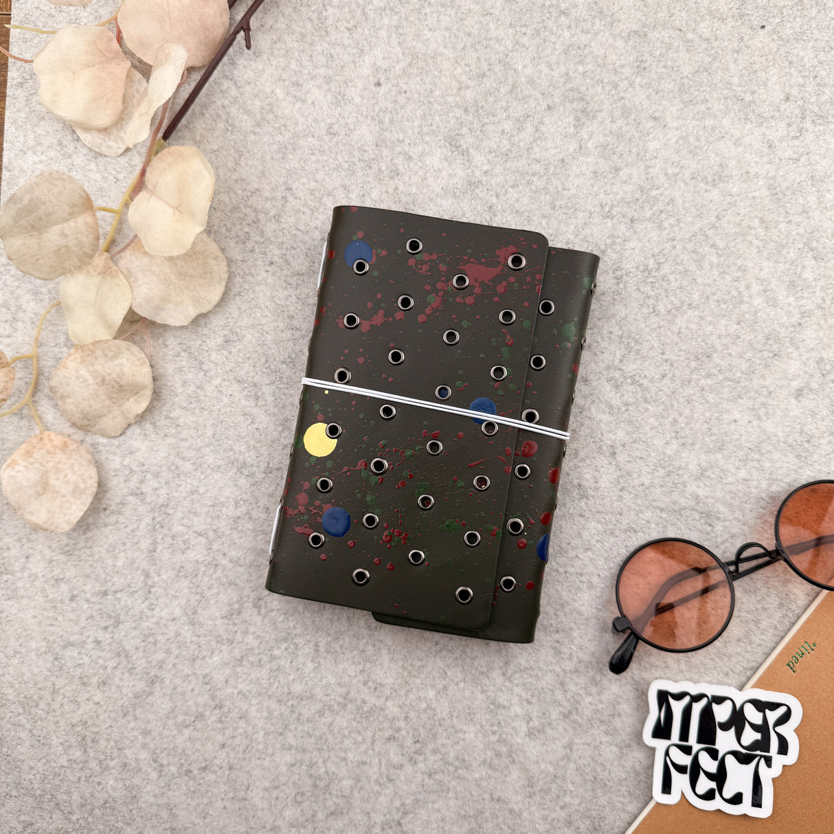 Imperfect Concepts Juniper Leather Notebook - A6 Trifold - Painted Olive w/ Gunmetal Grommets
