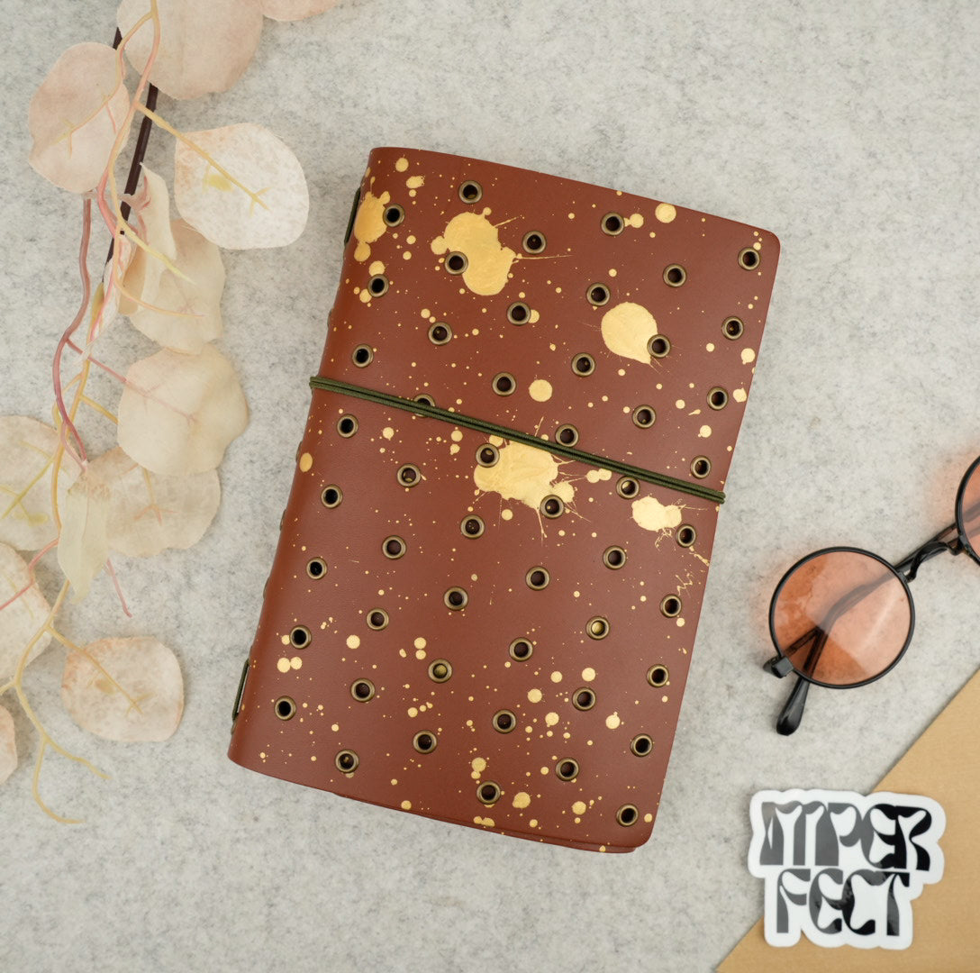 Imperfect Concepts Niko Leather Notebook - B6 Trifold - Painted Chocolate w/ Brass Grommets