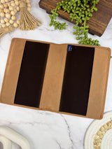 Girologio A5 Leather Notebook Cover in Saddle Tan, open showing the velvet liner