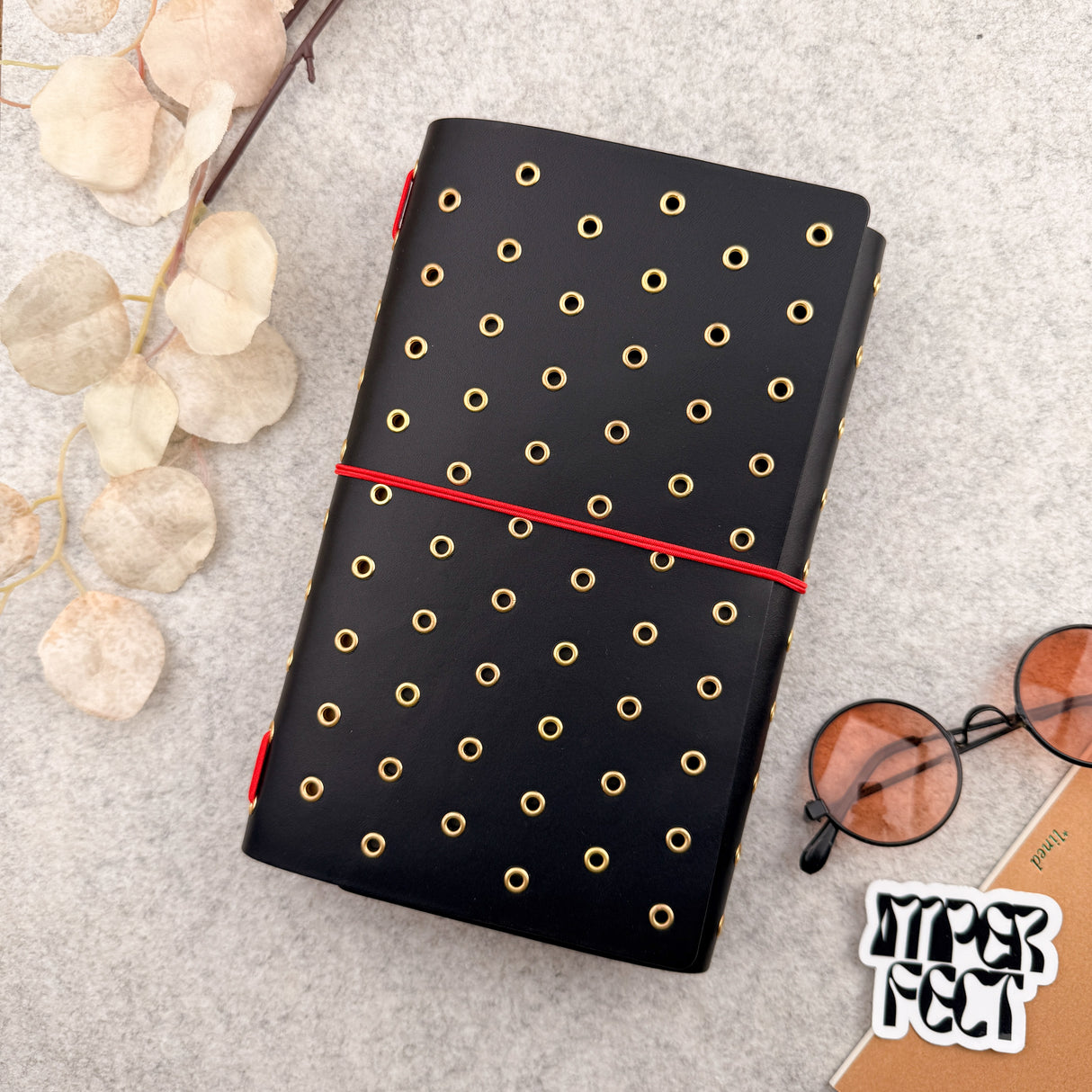 Imperfect Concepts Dancer Leather Notebook - A5 Trifold - Black w/ Gold Grommets