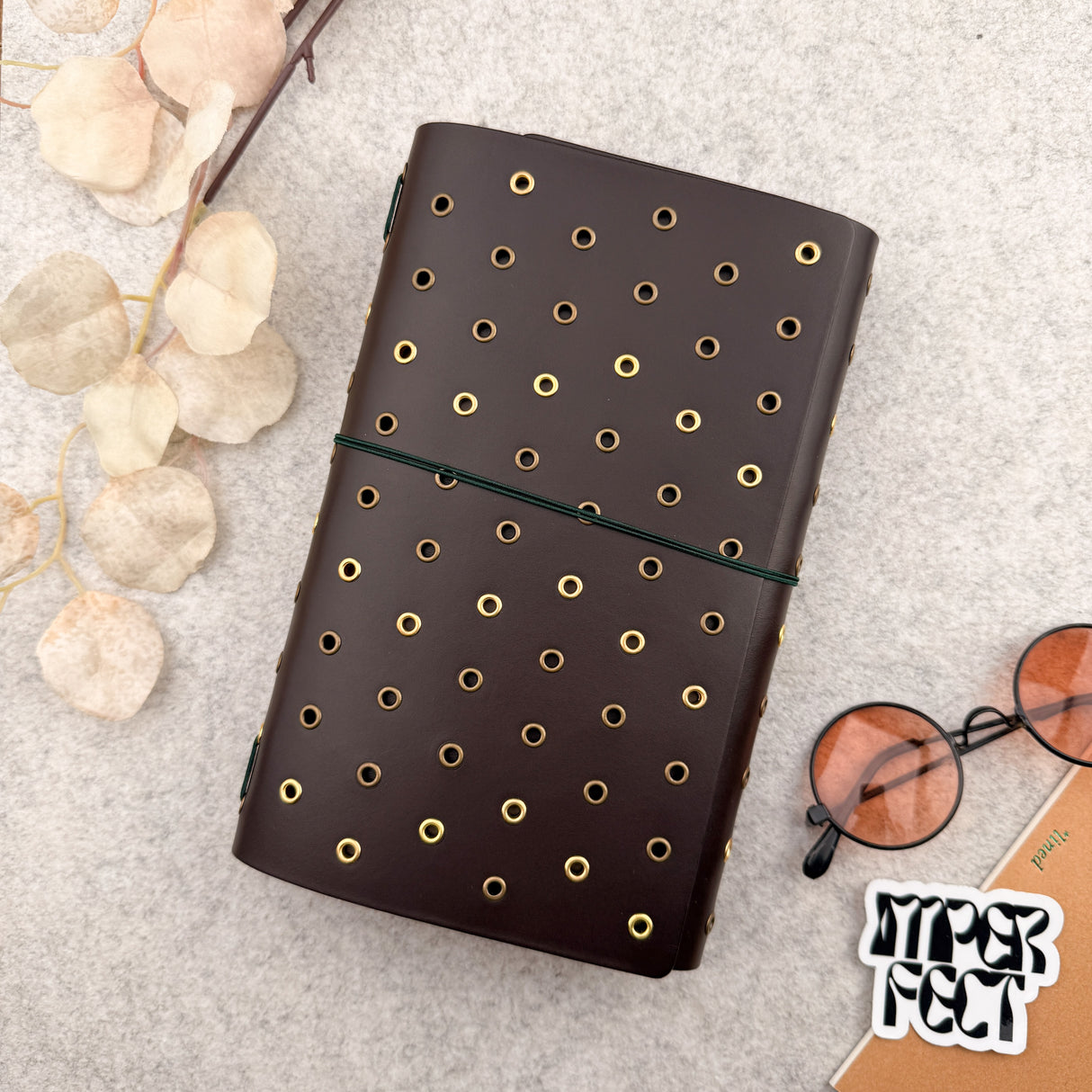 Imperfect Concepts Dancer Leather Notebook - A5 Trifold - Dark Brown w/ Gold & Brass Grommets