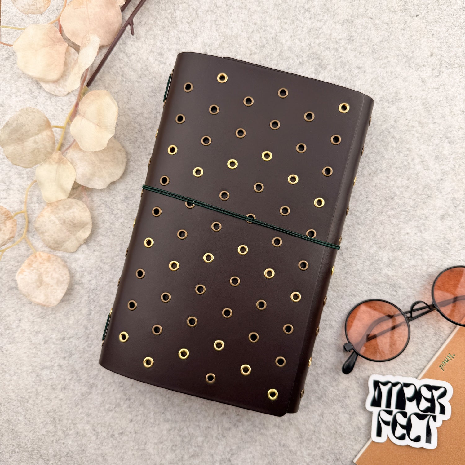 Imperfect Concepts Dancer Leather Notebook - A5 Trifold - Dark Brown w/ Gold & Brass Grommets