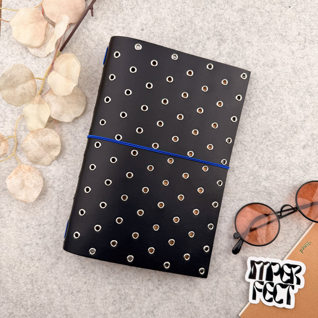 Imperfect Concepts Thatcher Leather Notebook - A5 Bifold - Black w/ SIlver Grommets