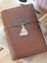 dana ate oatmeal! "paw prints" brass charm