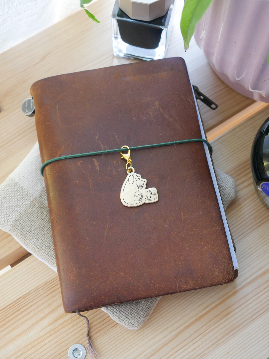 dana ate oatmeal! "paw prints" brass charm