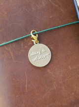 dana ate oatmeal! "stay a while" brass charm