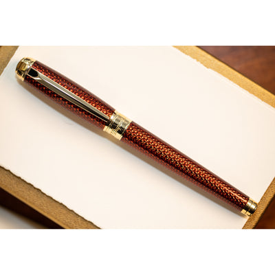 S.T. Dupont Line D Large Fire-head Guilloche Fountain Pen - Amber with Vermeil Trim | Atlas Stationers.